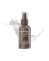 Bent hamse mattifying mist bottle with white liquid splash on a white background