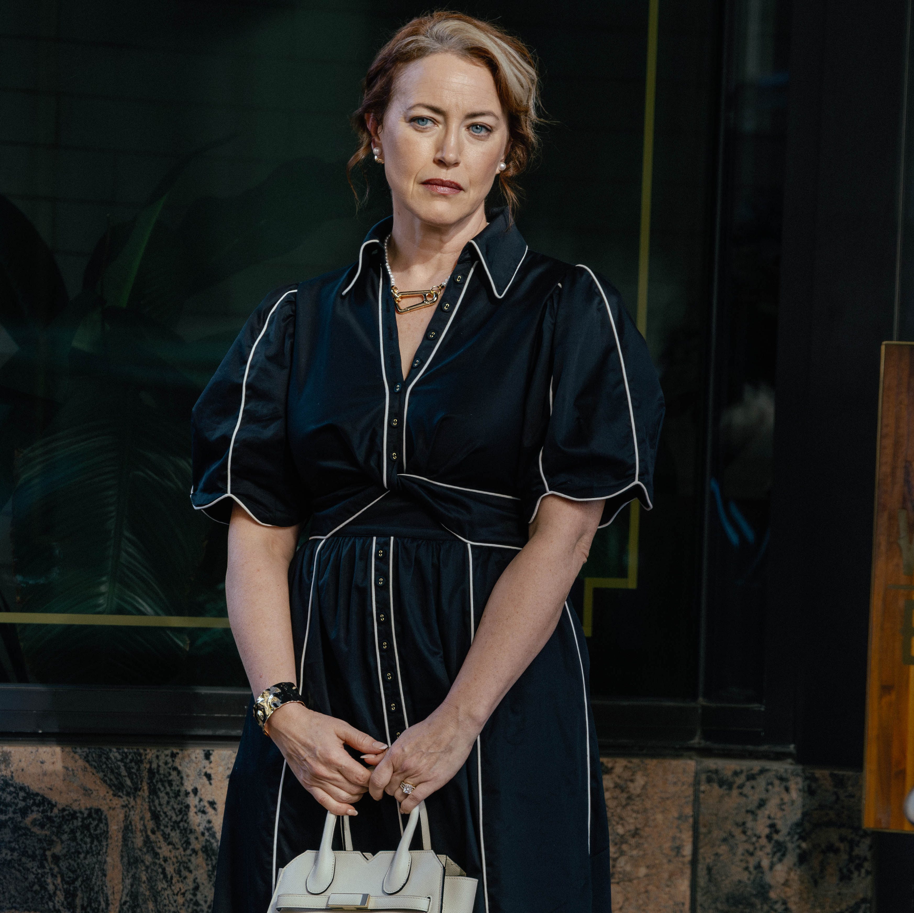 Liliana Weeks wearing Farm Rio black and white midi dress in The Madison