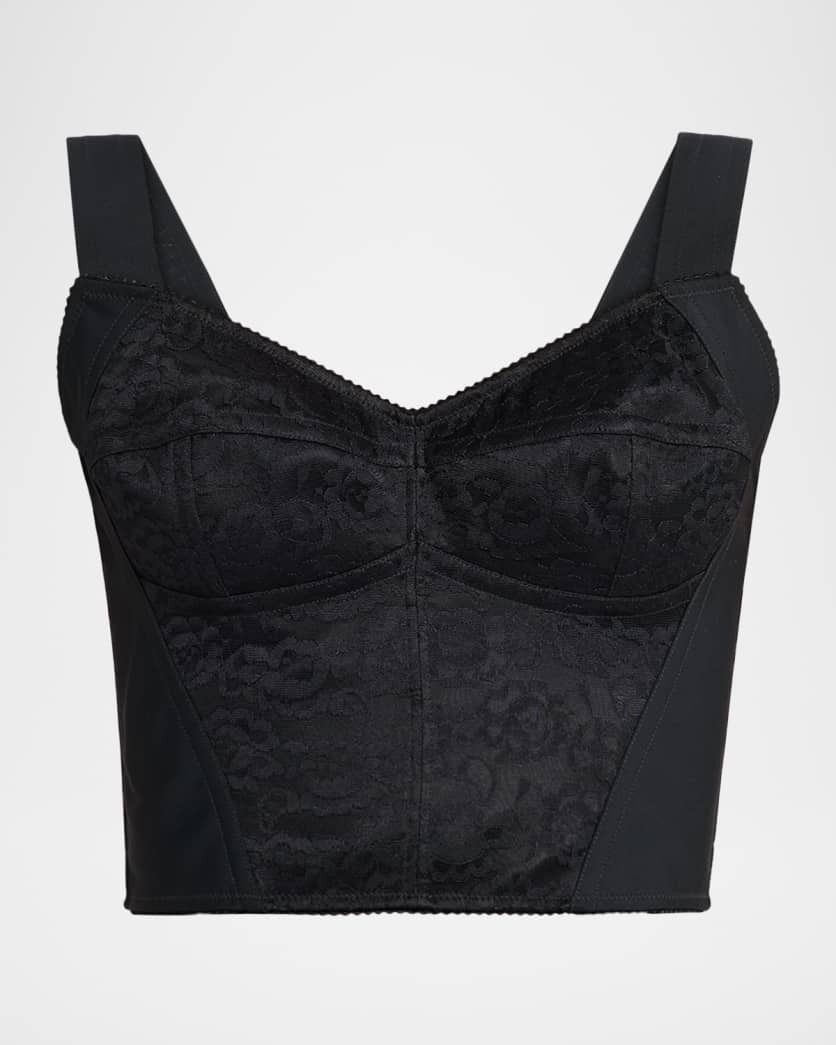 Black lace bralette on a light gray background