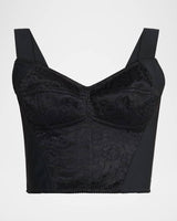 Black lace bralette on a light gray background