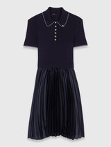 Navy pleated dress with a collar on a white background