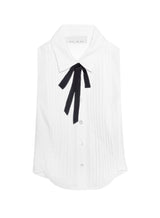 White blouse with a black bow tie on a white background