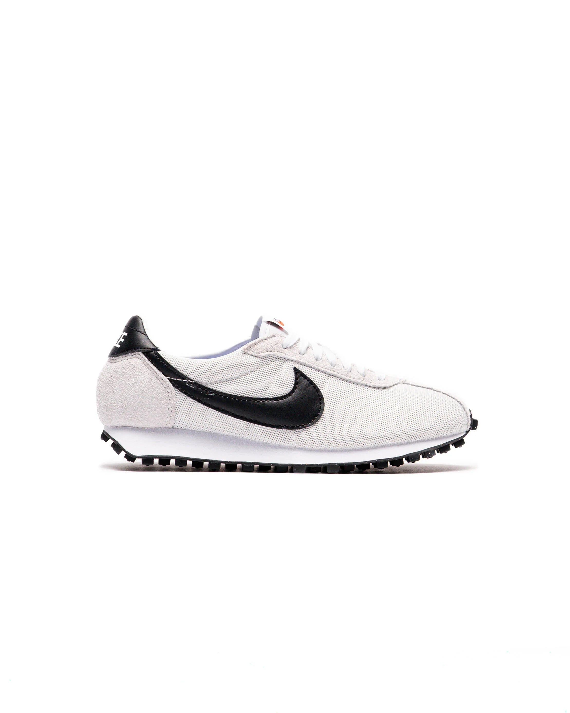 White sneaker with black swoosh logo on a white background