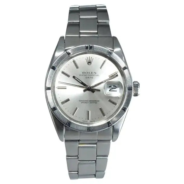 Silver wristwatch with a white face on a white background