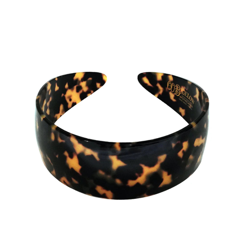 Tortoiseshell patterned headband on a white background