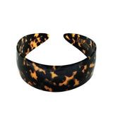Tortoiseshell patterned headband on a white background