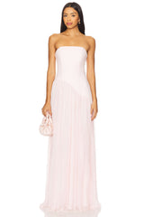 Woman wearing a strapless pink gown on a white background