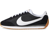Black and white sneaker with a visible Nike logo on a white background