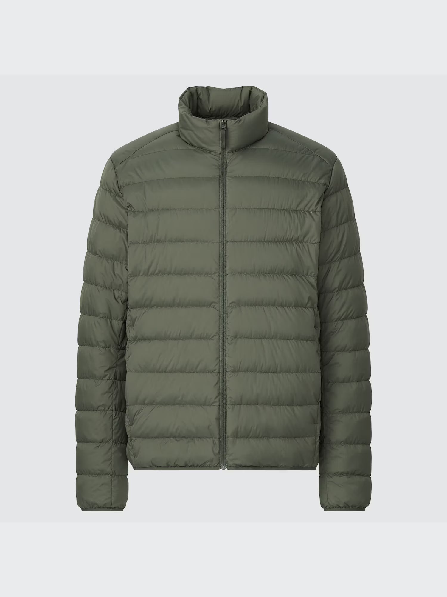 Green puffer jacket on a light gray background