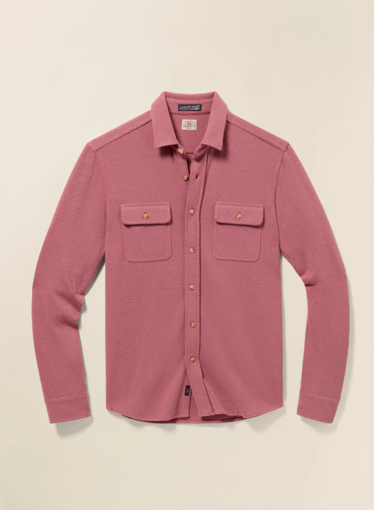 Pink button-up shirt with two chest pockets on a beige background