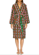 Woman wearing a colorful checkered robe on a white background