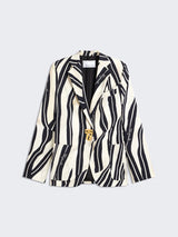 Zebra-striped blazer with gold buttons on a light gray background