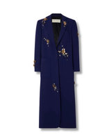 Long blue coat with floral embroidery on a white background