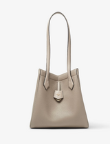 Beige handbag with a visible brand logo on a white background