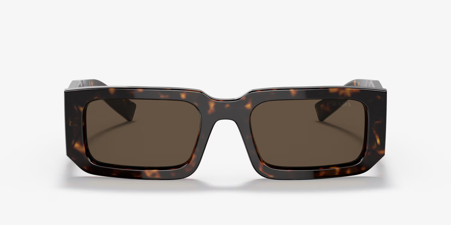 Sunglasses with tortoiseshell frame and dark lenses on a white background