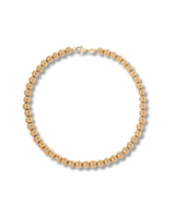 Gold beaded necklace on a white background