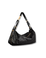 Black handbag with gold accents on a white background