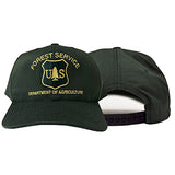 A dark forest green baseball cap with gold embroidered text reading 'FOREST SERVICE' and 'DEPARTMENT OF AGRICULTURE' around a 'U.S.