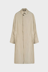 A light beige trench coat with a single button closure, collar, and front pockets, shown against a plain light gray background.
