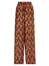 Trousers with a zigzag pattern in orange and purple on a white background