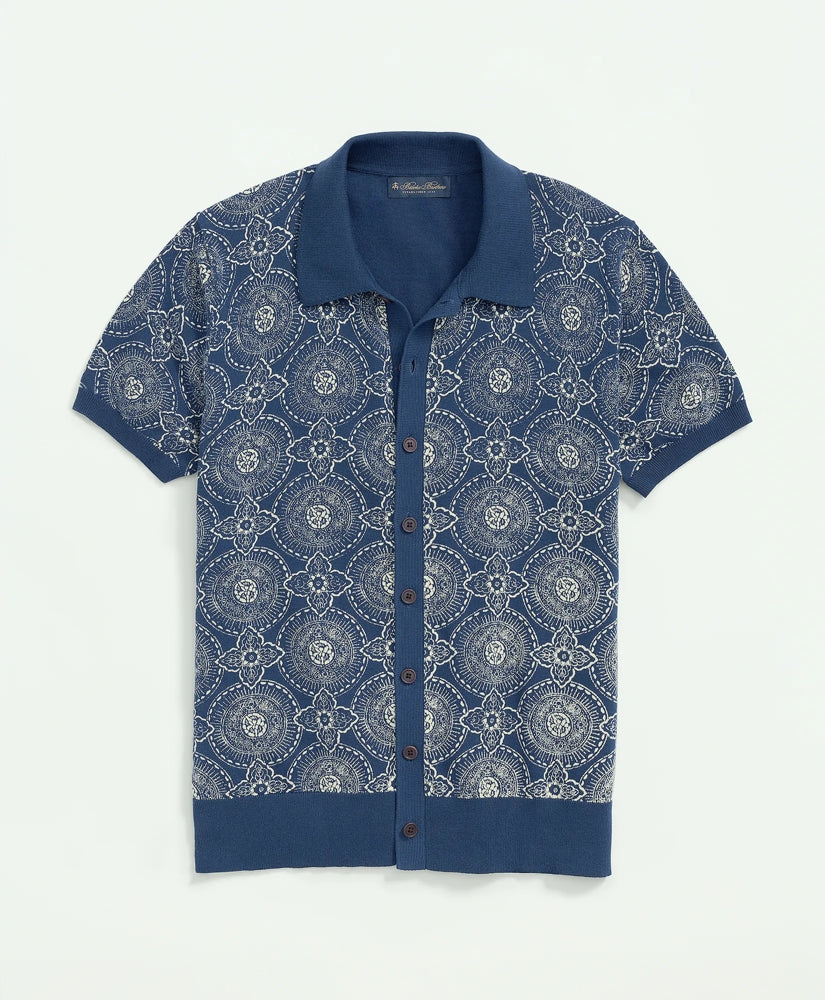 A blue and white batik-inspired block print cotton polo cardigan.
